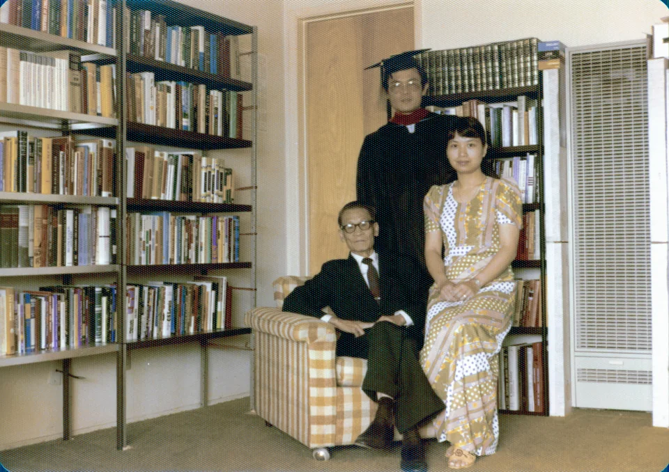 June 1976: David in his gown for the Master of Theology, with his father, Shau Man Tsang, and Esther. Identified by Angell.
