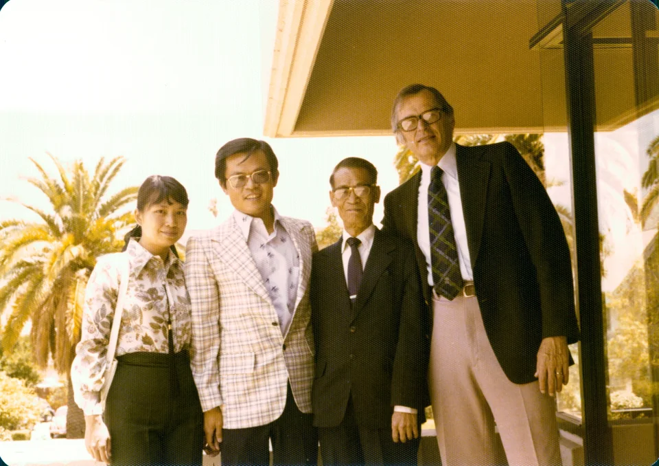 1977: Esther and David with his father, Shau Man Tsang, and Dr. Arthur Glasser, the dean whose signature is on the award. Identified by Angell.