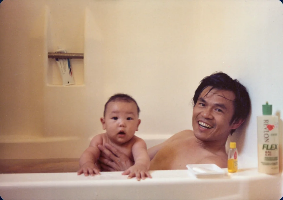 Bath time: David and Angell, 1980. Identified by Angell.