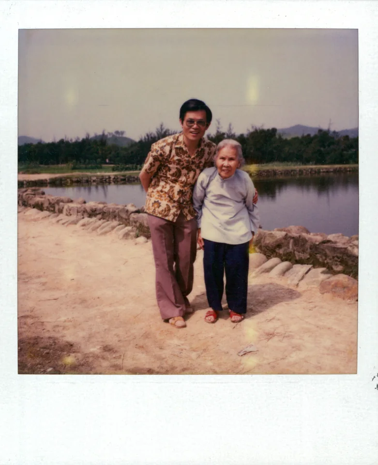 David with his mother, Choy Chuen Chan, beside the village pond, 1982.