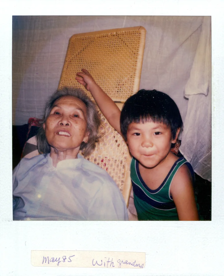 May 1985: Angell beside his grandmother Choy Chuen Chan in the village. The Polaroid is labelled “with grandma.” Identified by Angell.