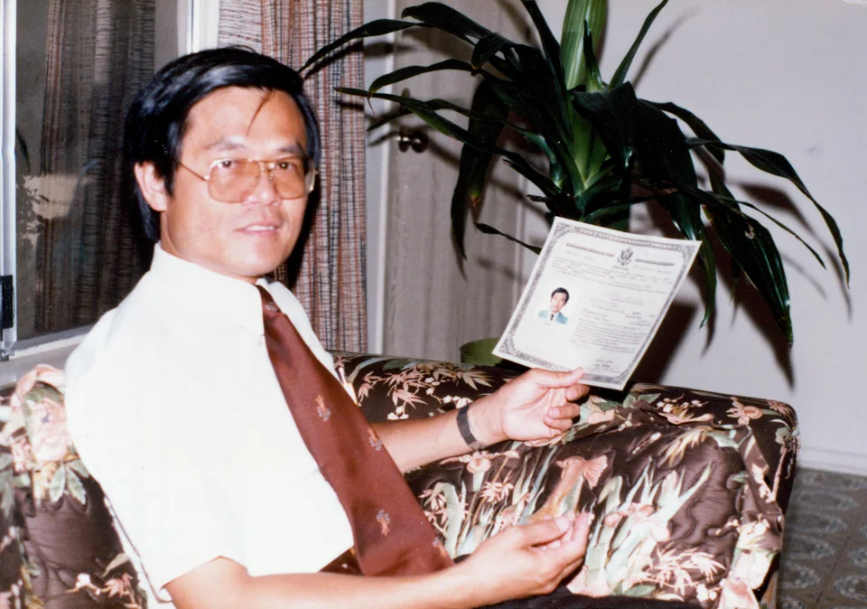 1985: David with his certificate of United States naturalization. The man who called himself a Hakka sojourner became a citizen of the country where he served. Identified by Angell.