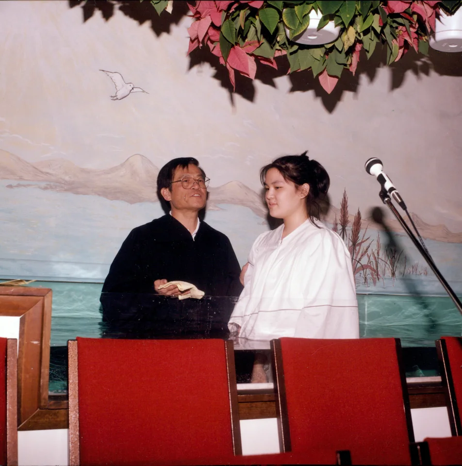 David baptizing his daughter Sunny, Columbia, Maryland, 1997. Identified by Angell.
