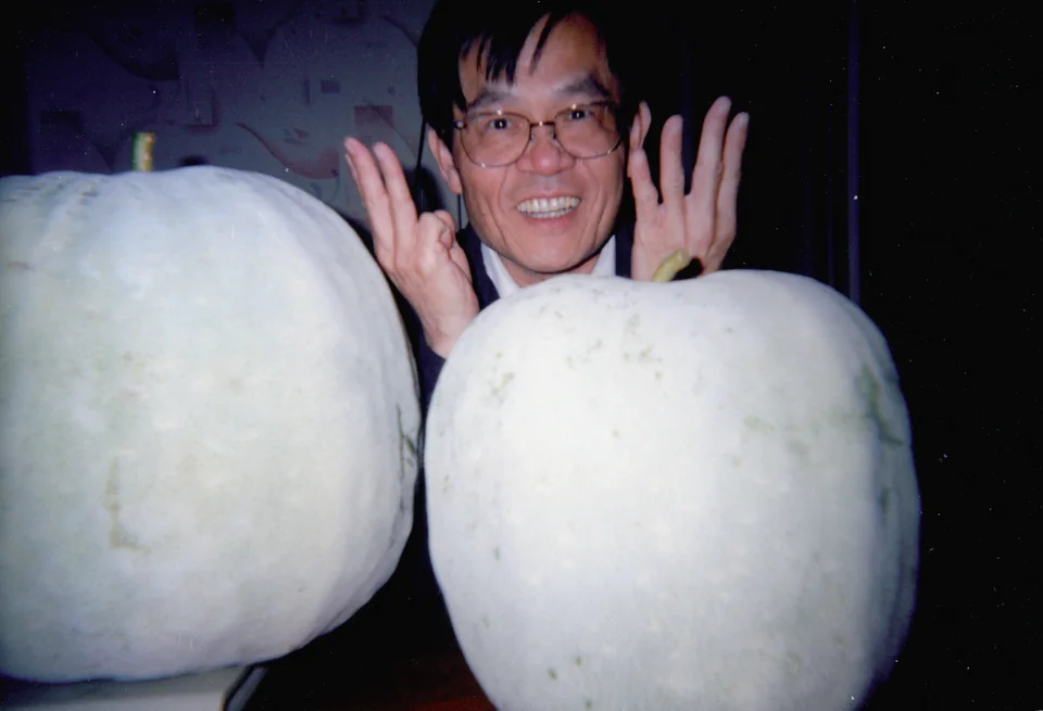 David with two winter melons he grew in New York, 2008. Identified by Angell.