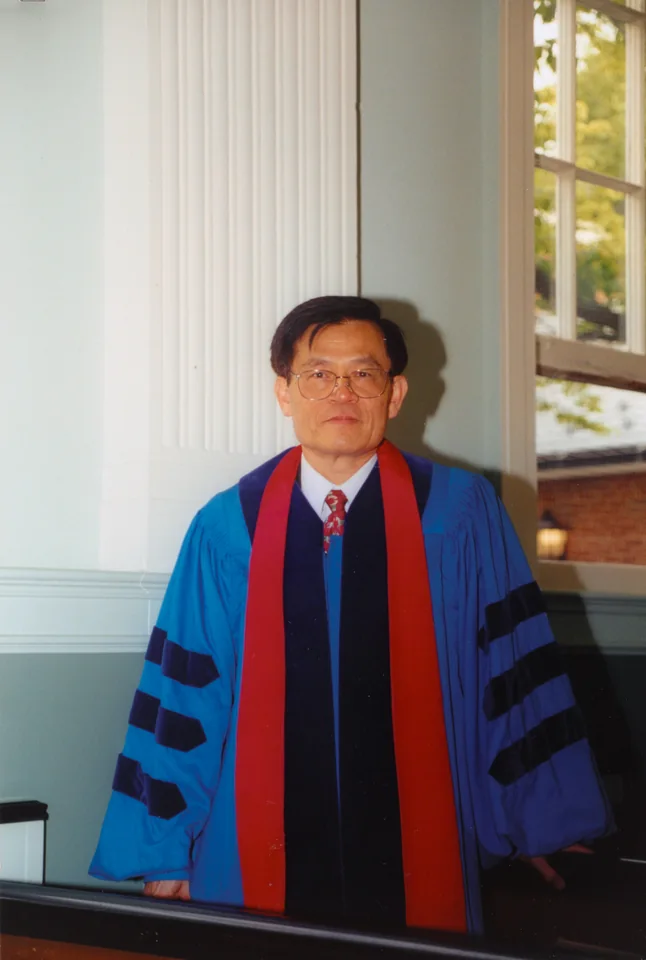 In his Fuller doctoral robe at OCM Boon Church, 2000. Identified by Angell; the back of the print is marked 2000.