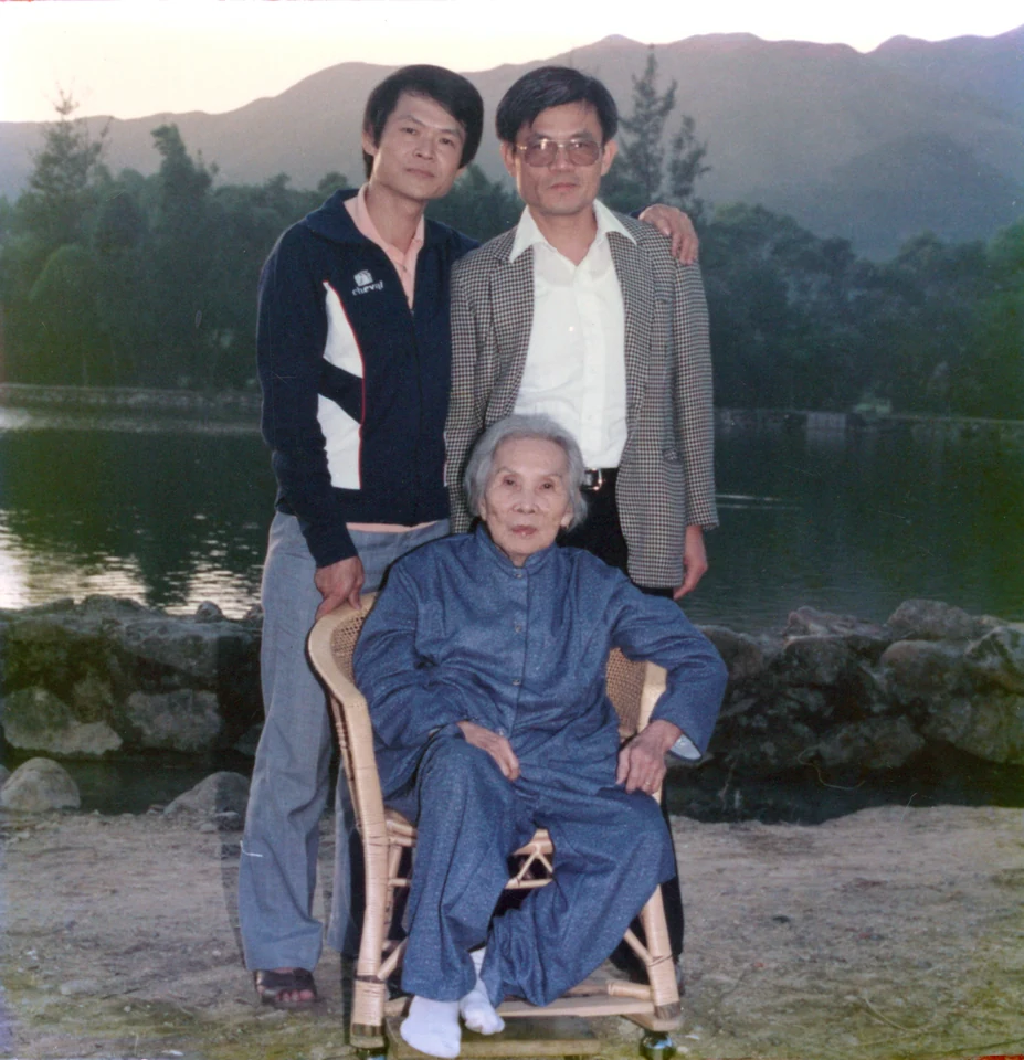 David, at right, with his mother, Choy Chuen Chan, and his tenth brother, Jacob, in their home village in 1985. Identified by Esther.